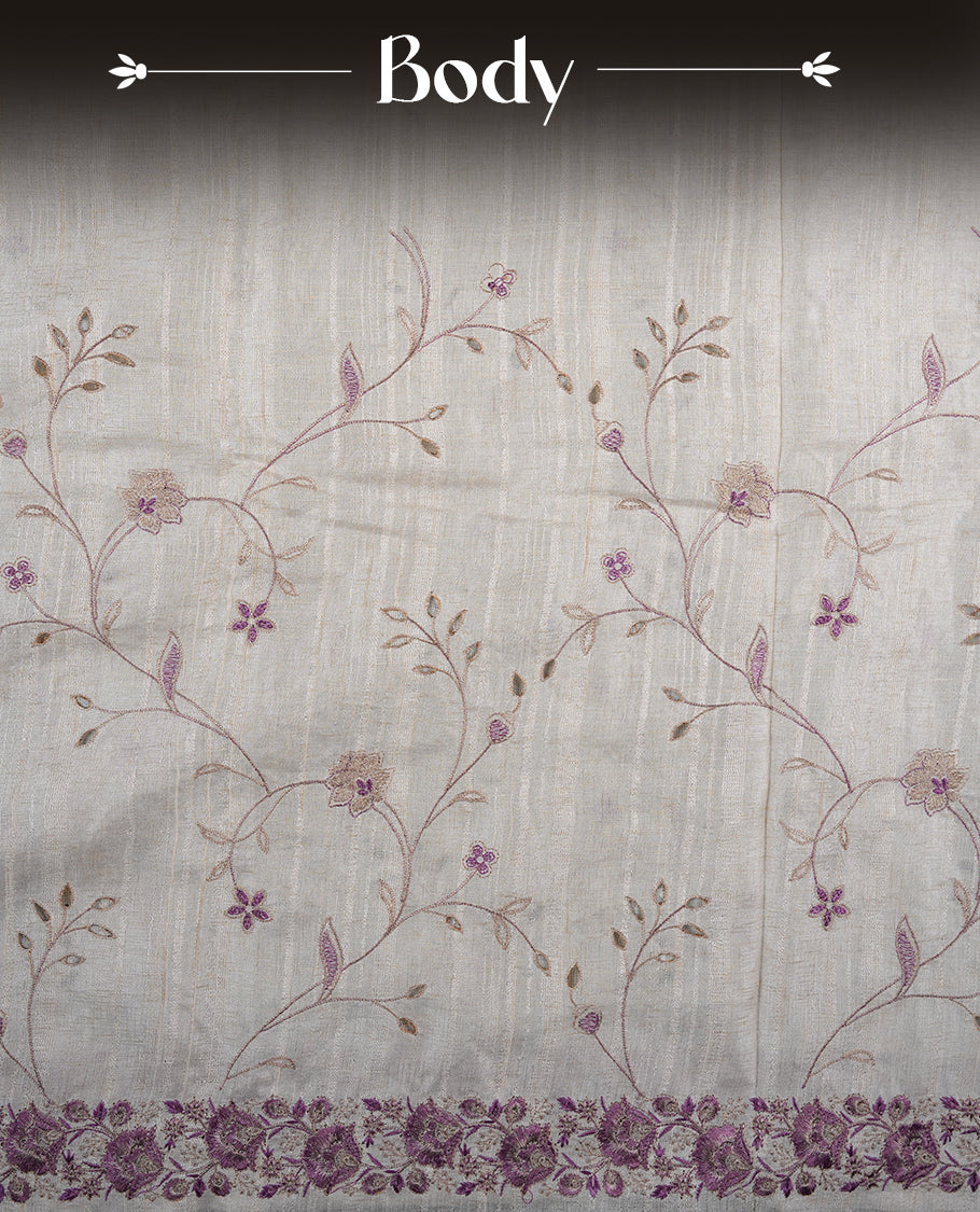 Cream colour semi tusser silk saree featuring with Lavender colour thread embroidery kodi pattern all over body, pallu, border and paired with matching blouse piece.