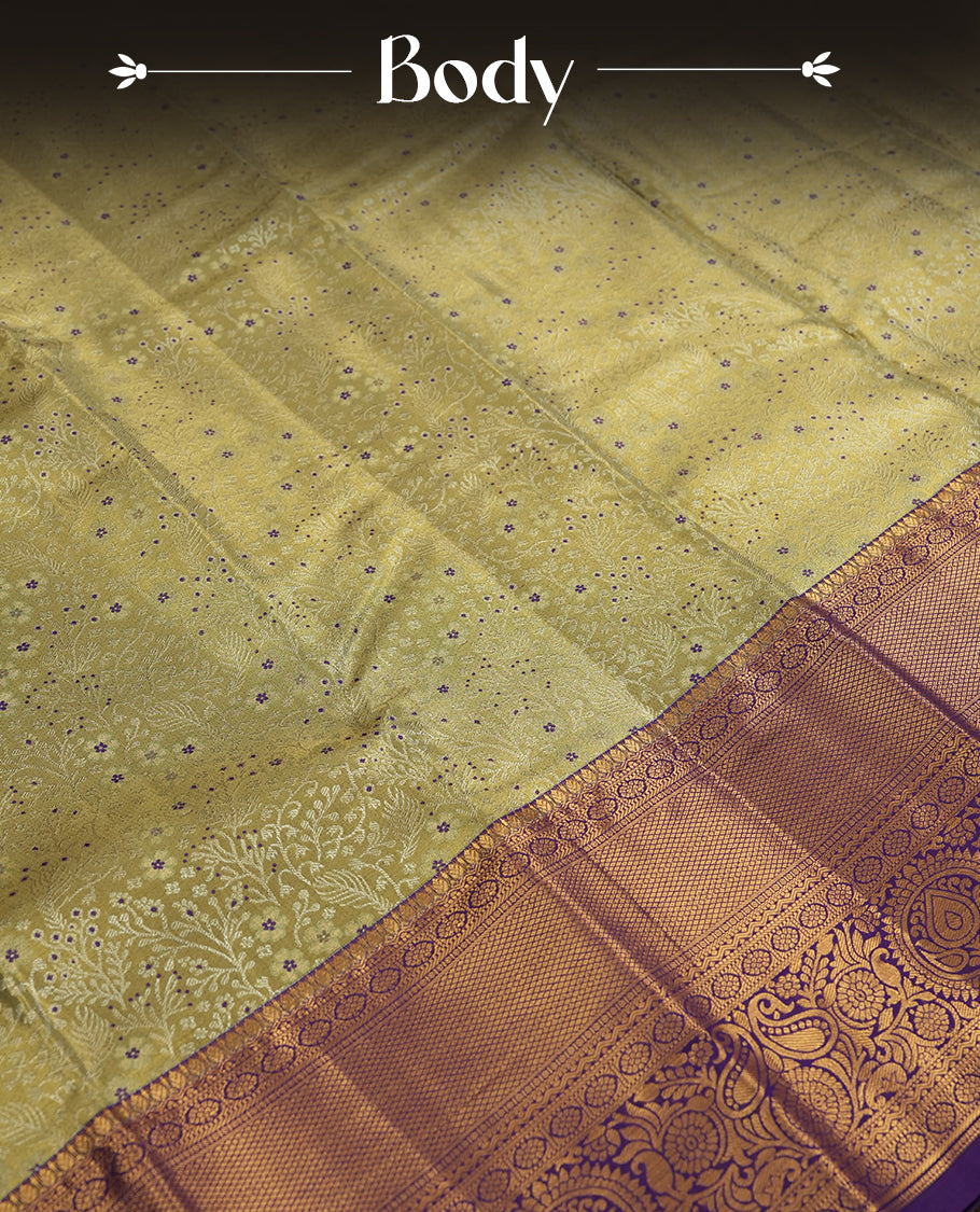 Pastel green and Antique silver Zari Tissue Brocade Saree features intricate coloured floral Motifs on body and a navy blue colour with traditional border & pallu, paired with matching blouse