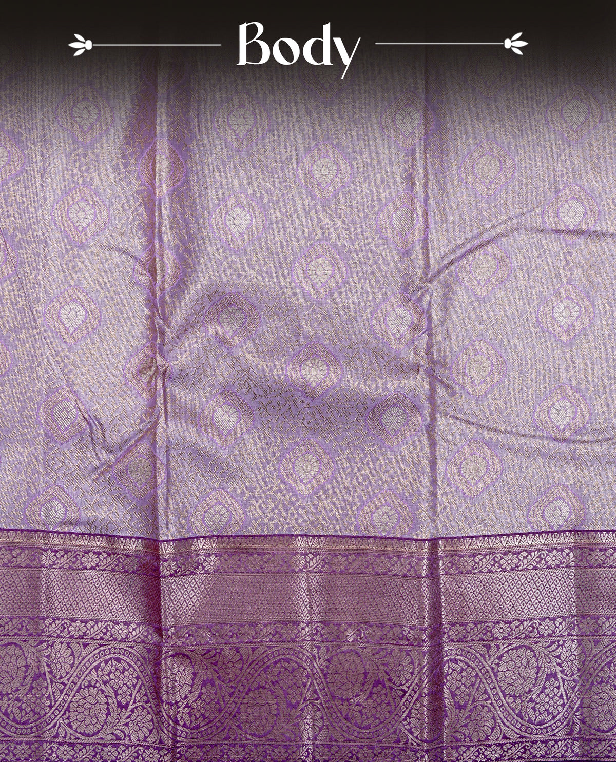 Lavender colour Semi tissue silk saree featuring Light gold zari kodi floral motifs on body, Contrast Purple colour with traditional border, paired with matching blouse piece.