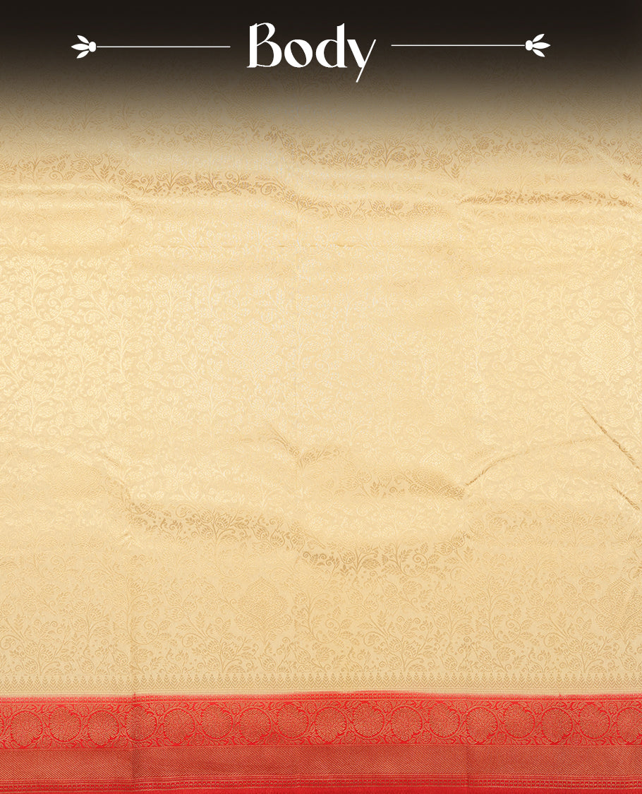 Cream colour semi silk brocade saree featuring intricate Gold floral kodi patterns across the body, complemented by a Contrast rich red colour woven border and pallu, paired with a matching blouse.