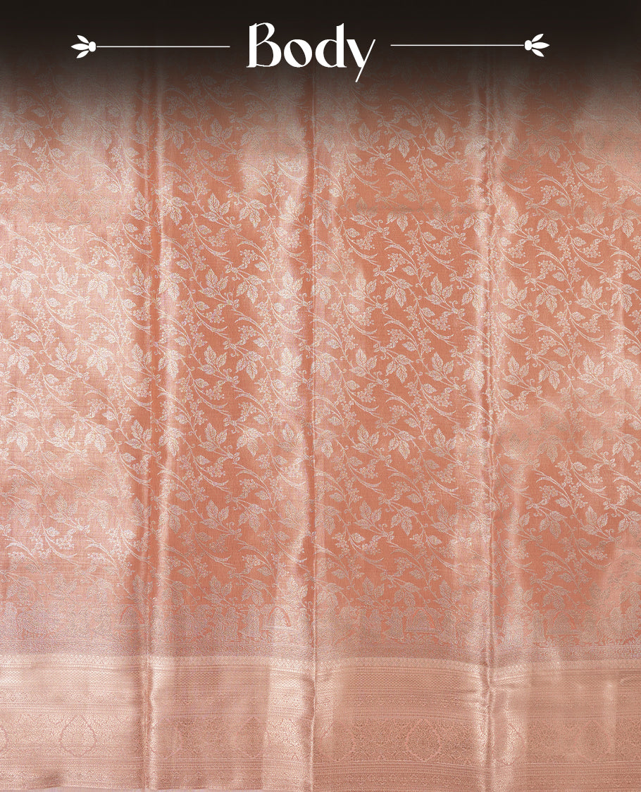 Peach colour and rose gold Zari Tissue Brocade Saree features intricate Motifs on body and rose gold colour traditional border & pallu, paired with matching blouse