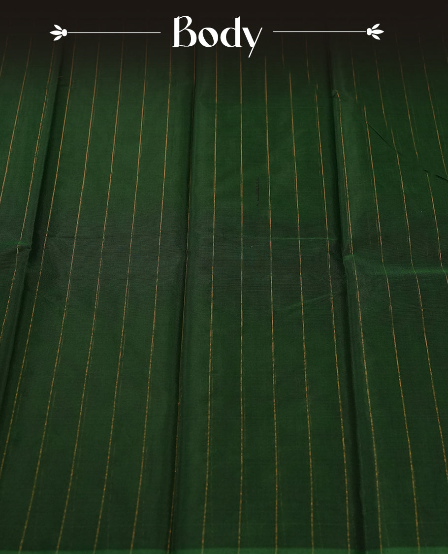 Dark green colour silk cotton saree featuring with delicate vertical copper zari lines on the body, Crafted without a border for a classy touch, Comes with a matching blouse for a perfectly coordinated look.