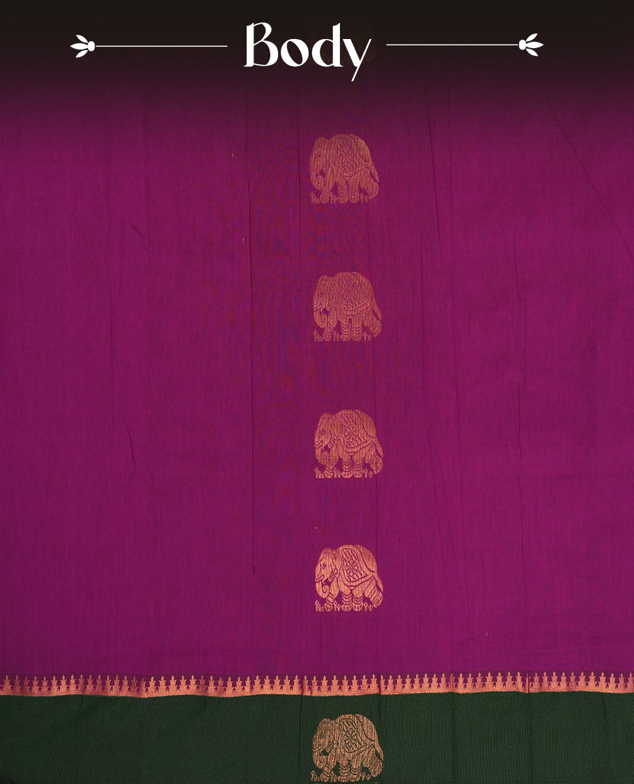 Purple colour Kalayani cotton saree featuring majestic copper zari elephant motifs on the body, paired with a contrasting green border and pallu adorned in intricate traditional designs with matching blouse