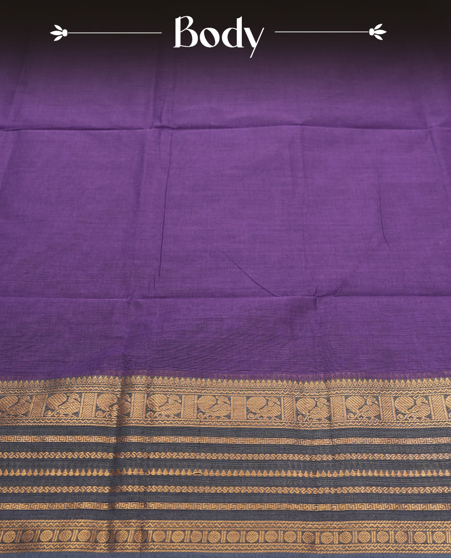 Royal Purple colour Silk Cotton Saree with Antique Gold Zari Border Showcasing Peacock Motifs and Geometric Stripes, Simple Body, Rich Pallu with Gold Stripes, and a Coordinated Matching Blouse Piece