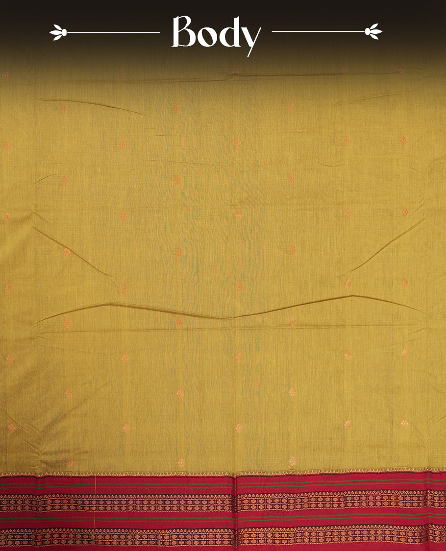 Deep mustard yellow Kalayani cotton saree with delicate woven motifs on the body, enhanced by a rich maroon zari border and pallu with traditional patterns, paired with a matching blouse piece.