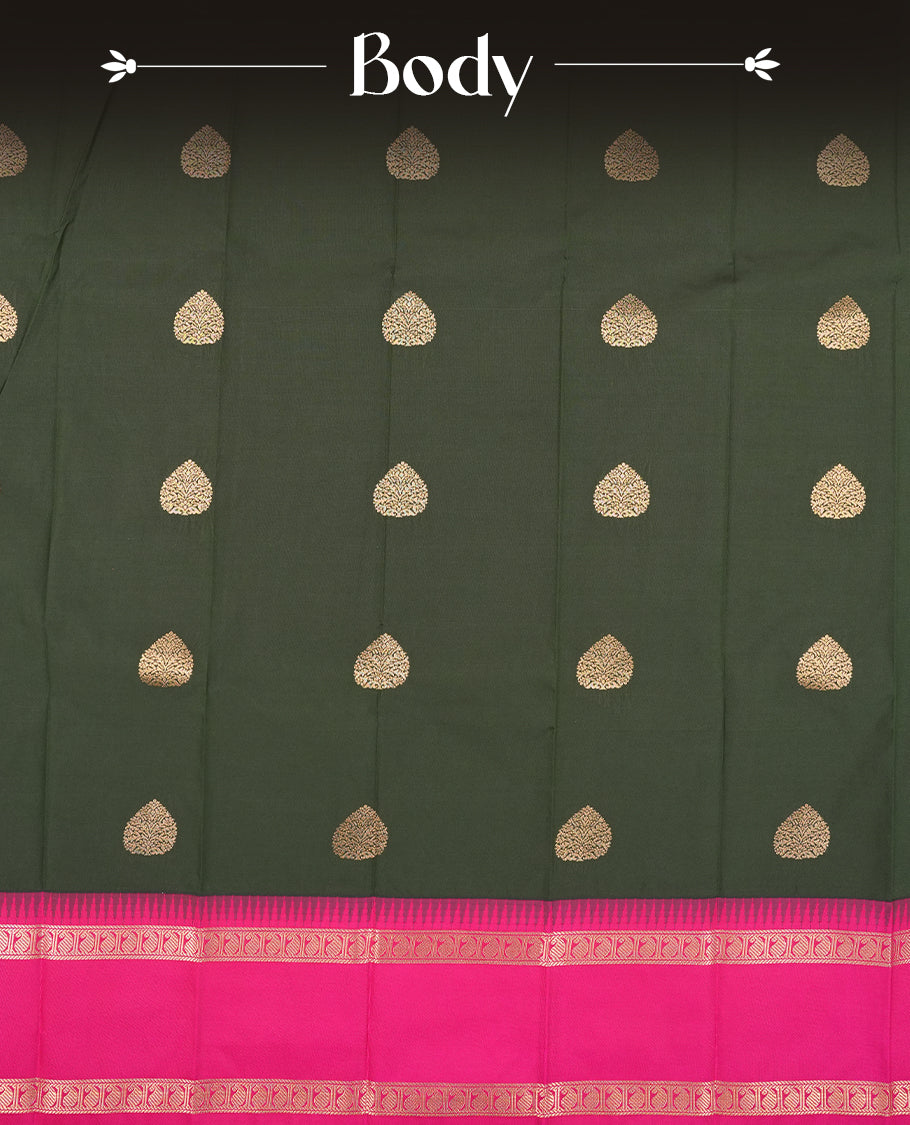 Dark green colour Semi Silk Saree with gold zari patterns on the body, paired with a contrasting rani pink colour traditional pallu and border, and a matching blouse piece.