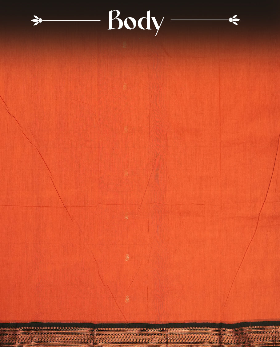 Orange colour Kalyani Cotton saree with rich black border and pallu, featuring copper zari peacock motifs and intricate weaving & Includes a matching blouse piece.