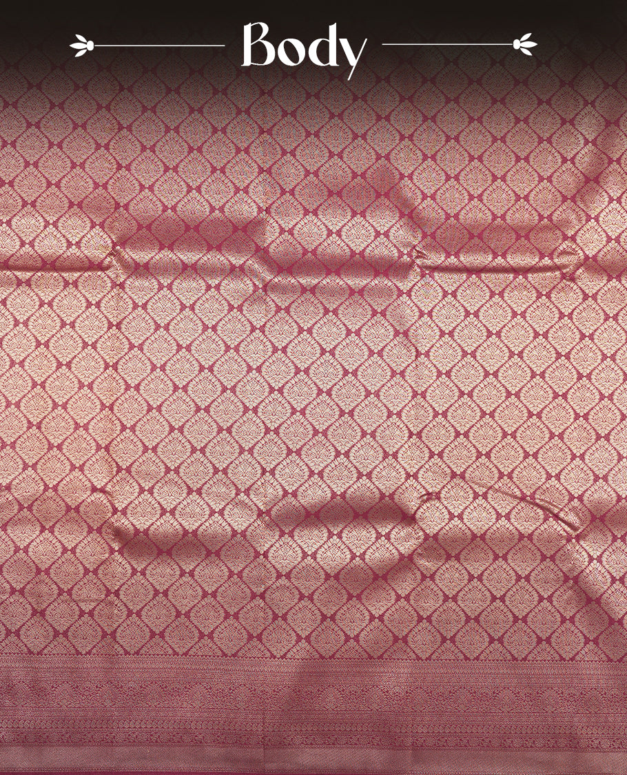 Deep brown colour semi silk brocade saree featuring intricate Gold butta patterns across the body, complemented by a rich self colour woven border and pallu, paired with a matching blouse.