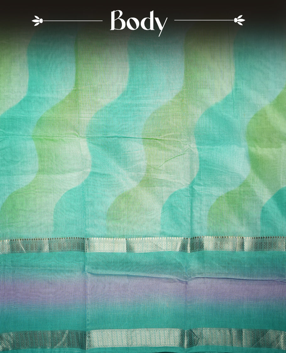 Turquoise and mint green colour mixed chanderi cotton saree with wavy ombre body, silver zari borders, lavender-pink gradient border accents, and matching turquoise blouse.