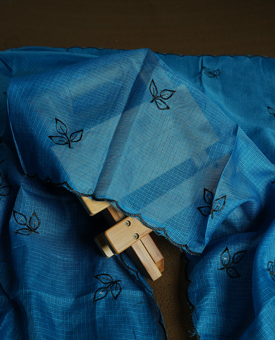 Blue colour churidhar material featuring Black colour thread embroidery on the front panel, self colour dupatta with elegant border, and matching plain bottom