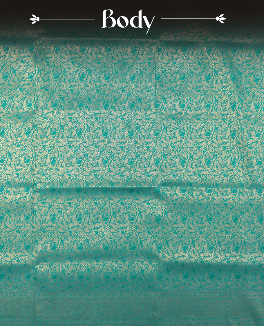 Teal colour semi soft silk saree featuring an all-over woven leaf pattern, finished with a matching border adorned with detailed paisley and floral motifs, and a matching blouse piece.