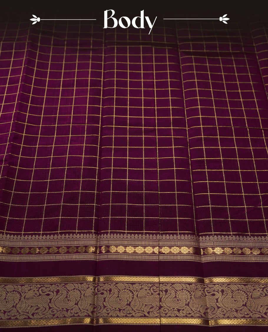 Deep Magenta colour pure Kanchi cotton saree featuring with delicate golden checks on body, paired with a contrasting beige zari woven border & Includes a matching blouse piece for a complete look.