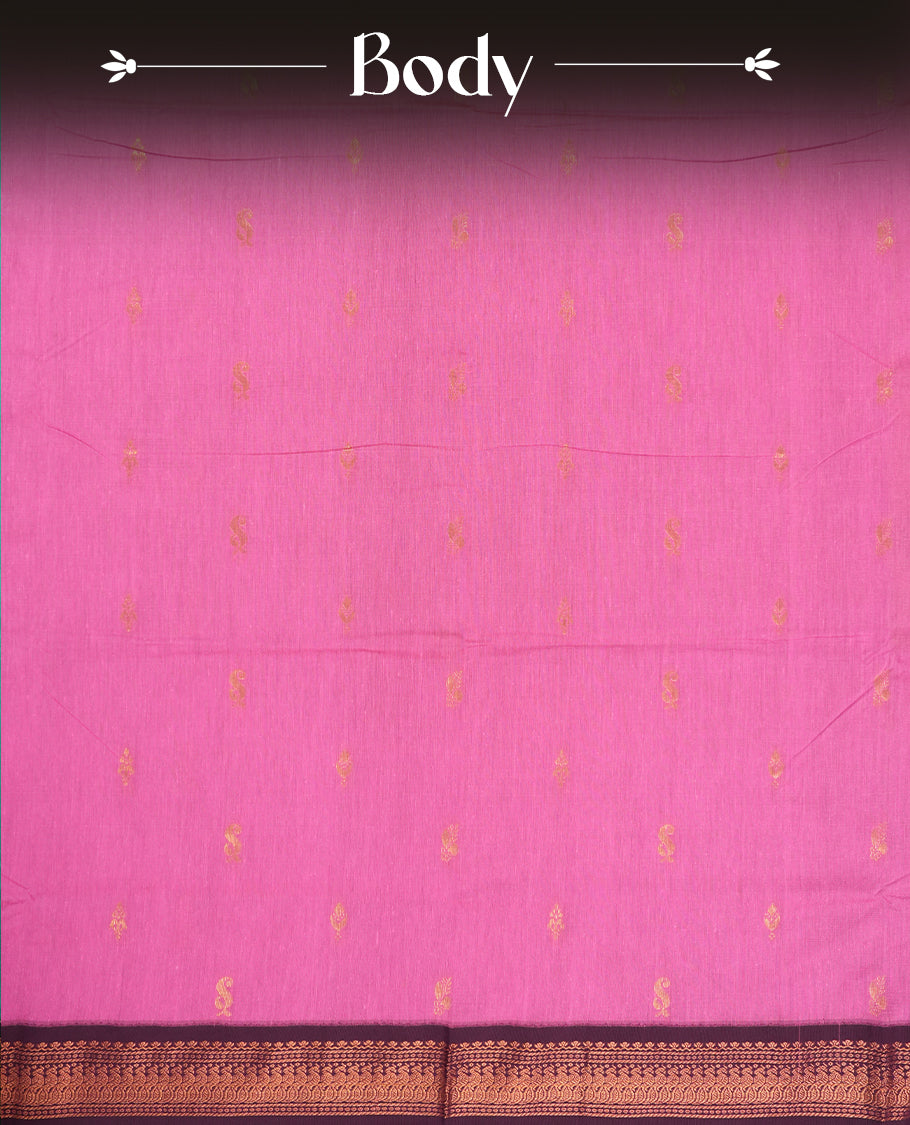 Pink colour Kalyani cotton saree with subtle zari motifs all over, paired with a contrasting plum wine colour rich copper zari woven border and pallu & Comes with a matching blouse piece.