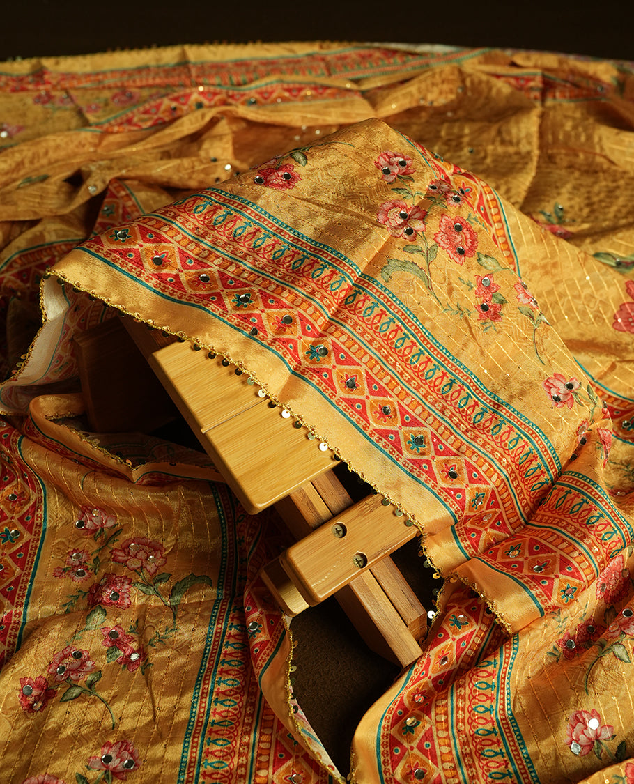 White colour churidhar material featuring Mirror and thread embroidery, foral print pattern on the contrast Yellow colour front panel, floral digital printed dupatta with elegant border, and matching plain bottom