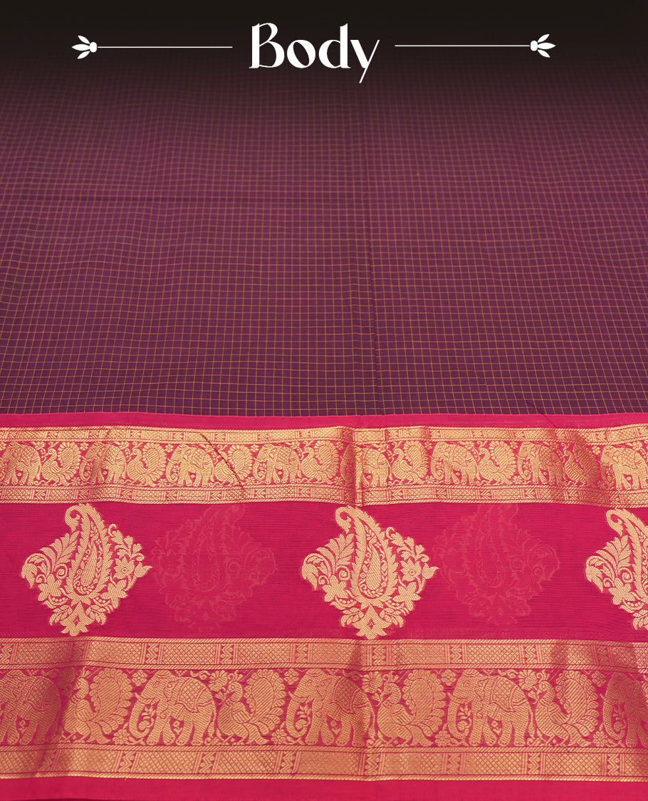 Maroon Colour silk cotton saree with gold zari elephant and floral design on the border, contrast pallu with traditional motifs, and a coordinated maroon blouse carrying the same rich zari border.