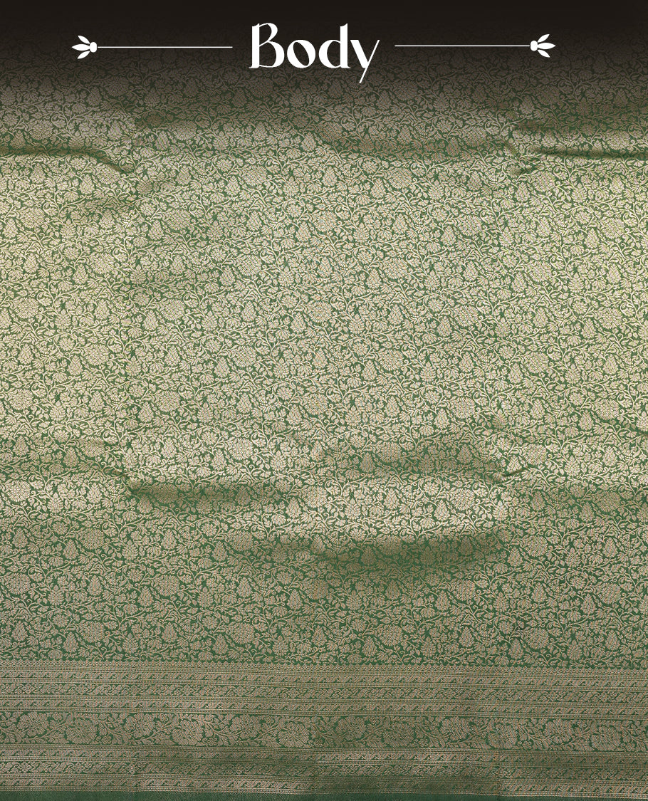 Green colour semi silk brocade saree featuring intricate Gold Floral kodi patterns across the body, complemented by a rich self colour woven border and pallu, paired with a matching blouse.