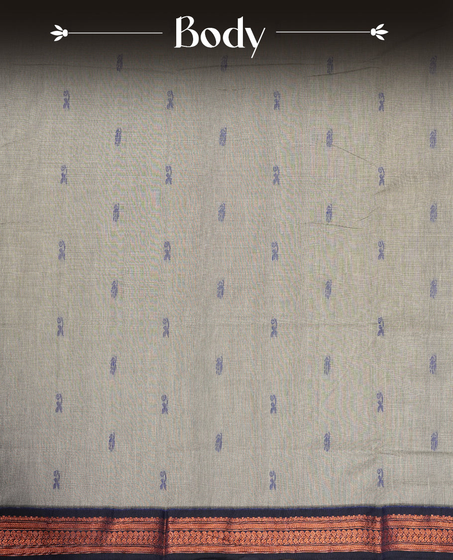 Grey colour Kalyani Cotton saree with woven zari royal blue floral motifs all over, paired with a contrasting royal blue border, floral & birds work on pallu intricately woven with rich copper zari & Comes with a matching blouse piece.