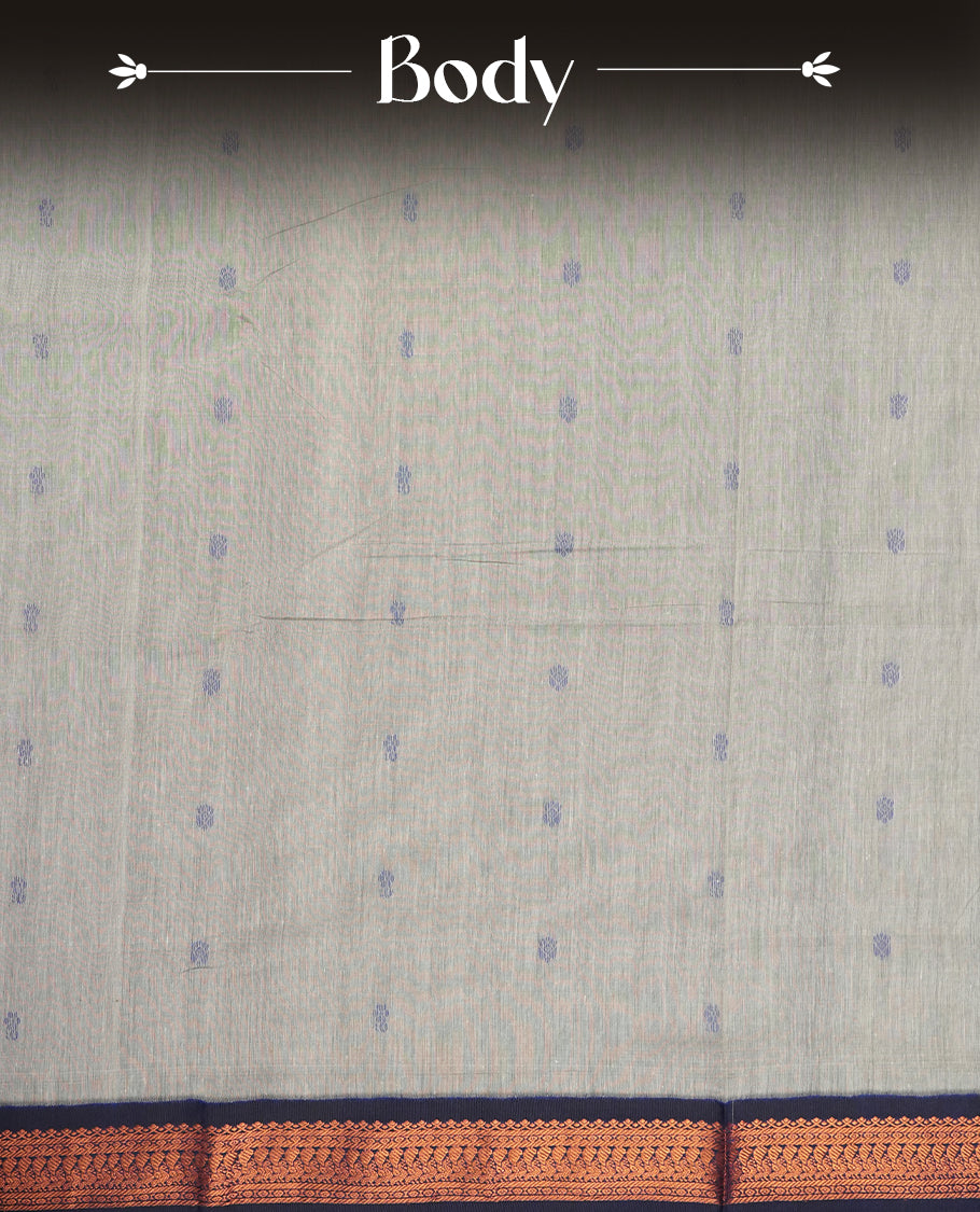 Grey colour Kalyani Cotton saree with delicate woven zari royal blue motifs all over, paired with a contrasting royal blue border and pallu intricately woven with rich copper zari & Comes with a matching blouse piece.