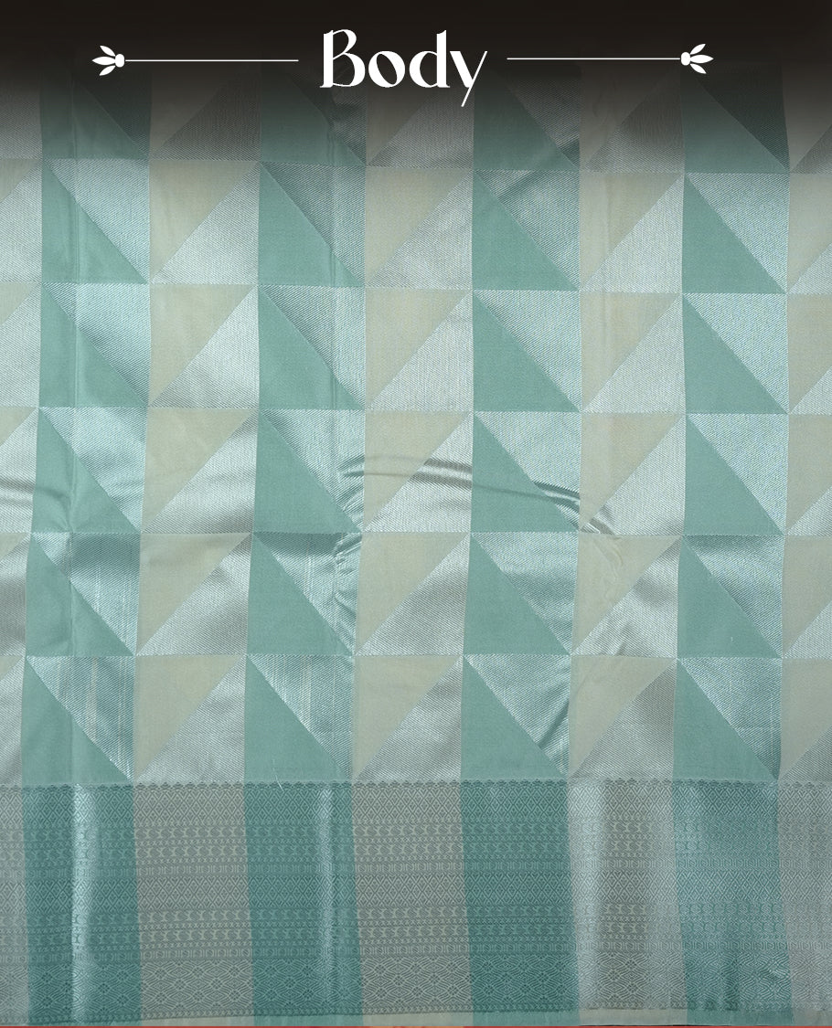 Mint & cream colour semi soft silk saree featuring a silver zari patterned body, complemented by silver zari motifes on pallu & border and a matching blouse piece.