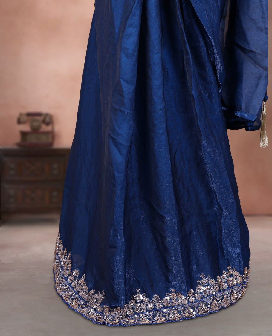 Elegant Dark teal colour ready to wear saree adorned with rich silver bead embroidery along the border and pallu, paired with a heavily embellished matching blouse for a grand festive look.