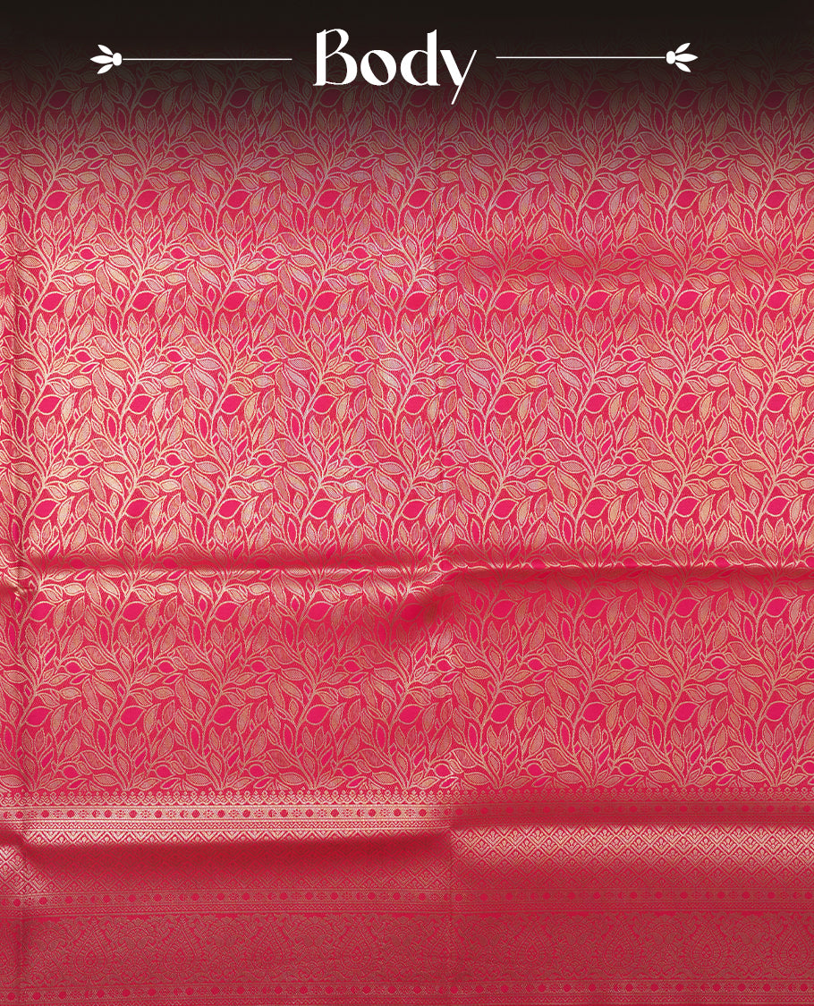 Dark Magenta colour semi soft silk saree featuring an all-over woven leaf pattern in gold colour, finished with a matching border adorned with detailed paisley and floral motifs, and a matching blouse piece.