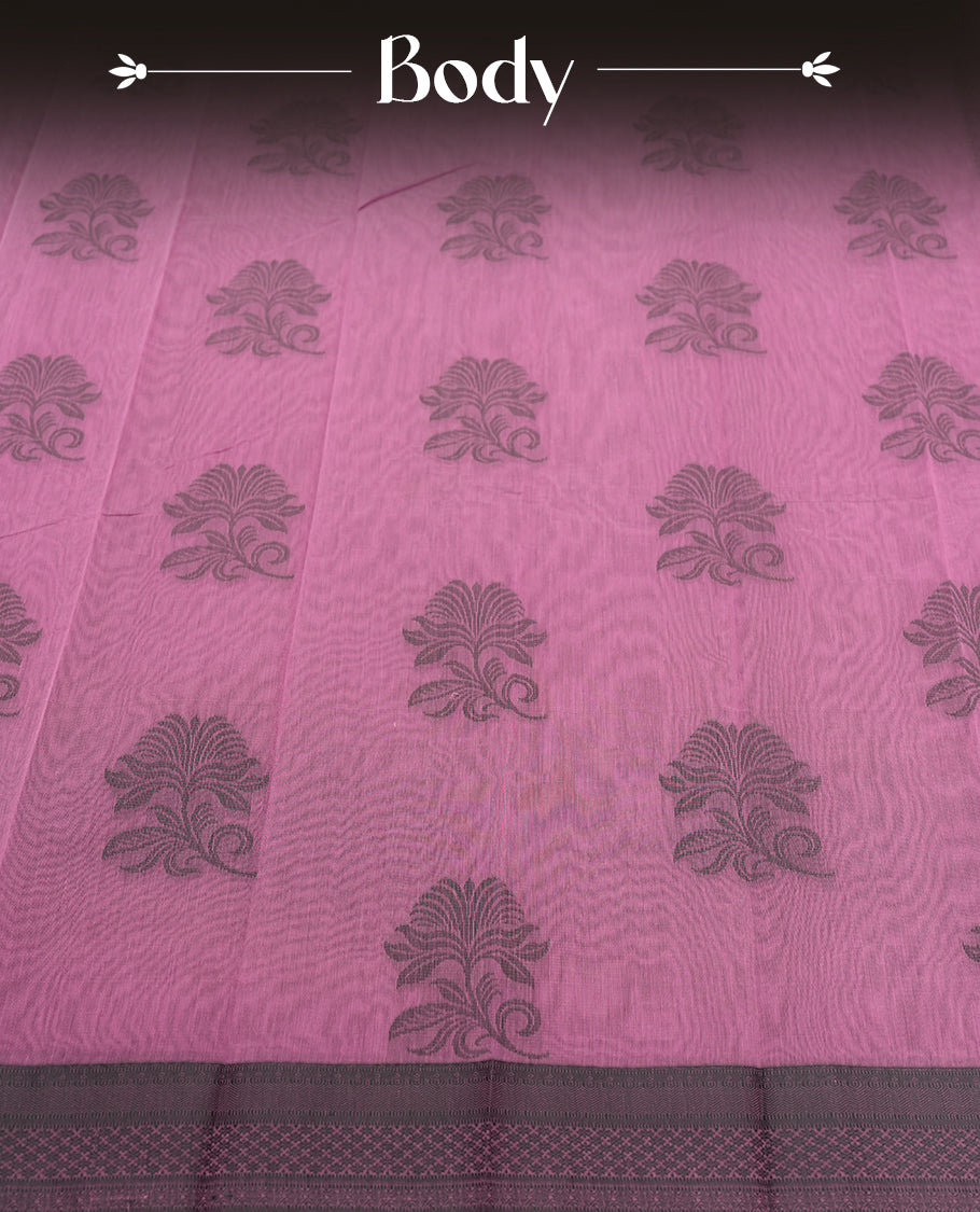 Pastel purple colour silk cotton saree featuring elegant floral zari motifs on the body, complemented by a rich contrast dark border and pallu with traditional woven detailing & Comes with a matching blouse piece.