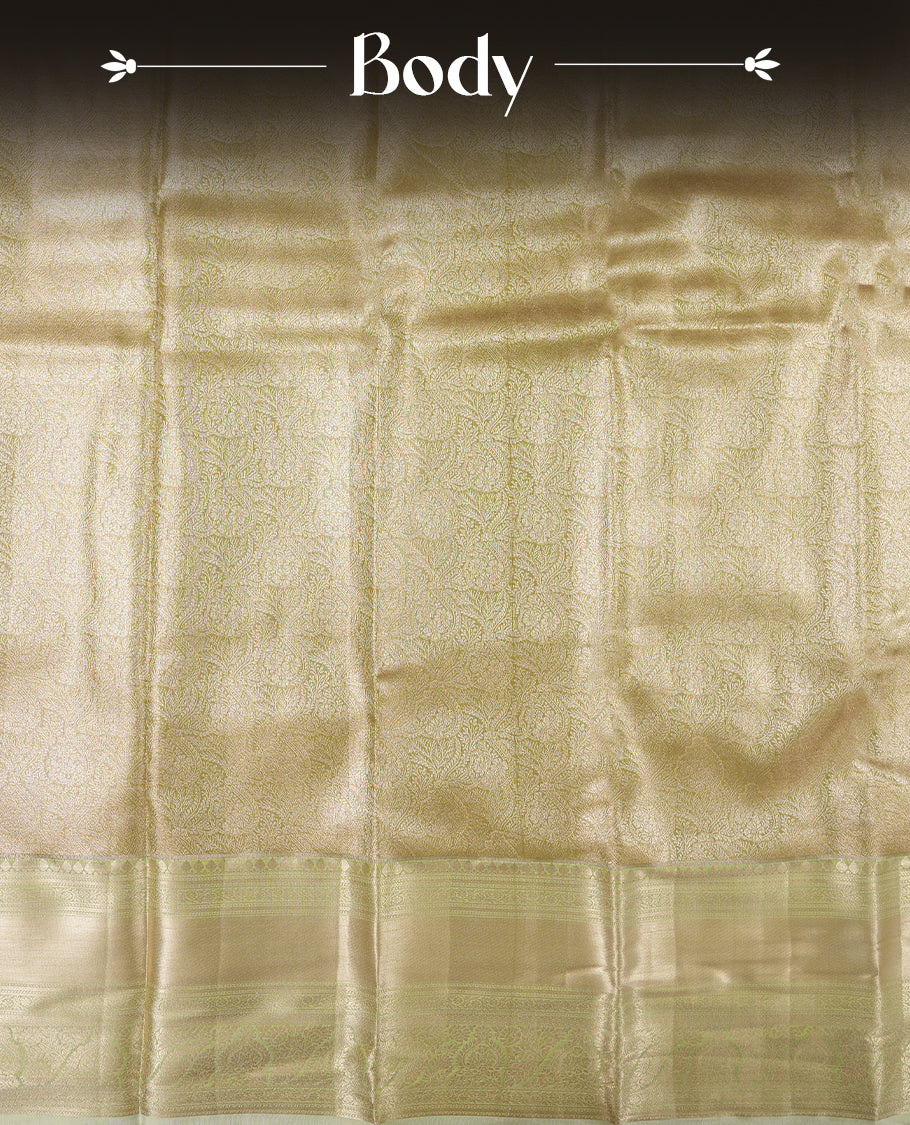 Golden green colour and rose gold Zari Tissue Brocade Saree features intricate floral Motifs on body and pastel green colour contrast border with traditional border & pallu, paired with matching blouse