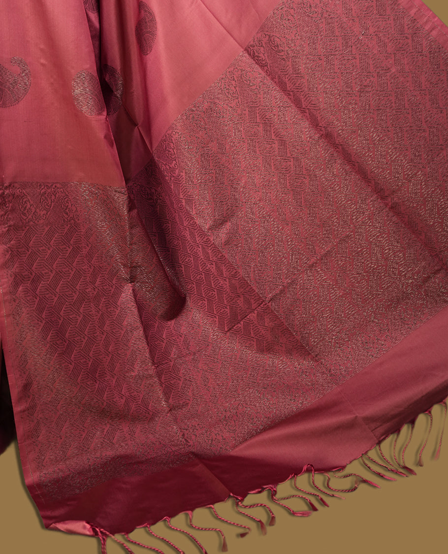 Cherry pink colour semi soft silk saree, adorned with subtle woven mango motifs on the body & The design is elevated with an elegant zari border and pallu, paired with a matching blouse.