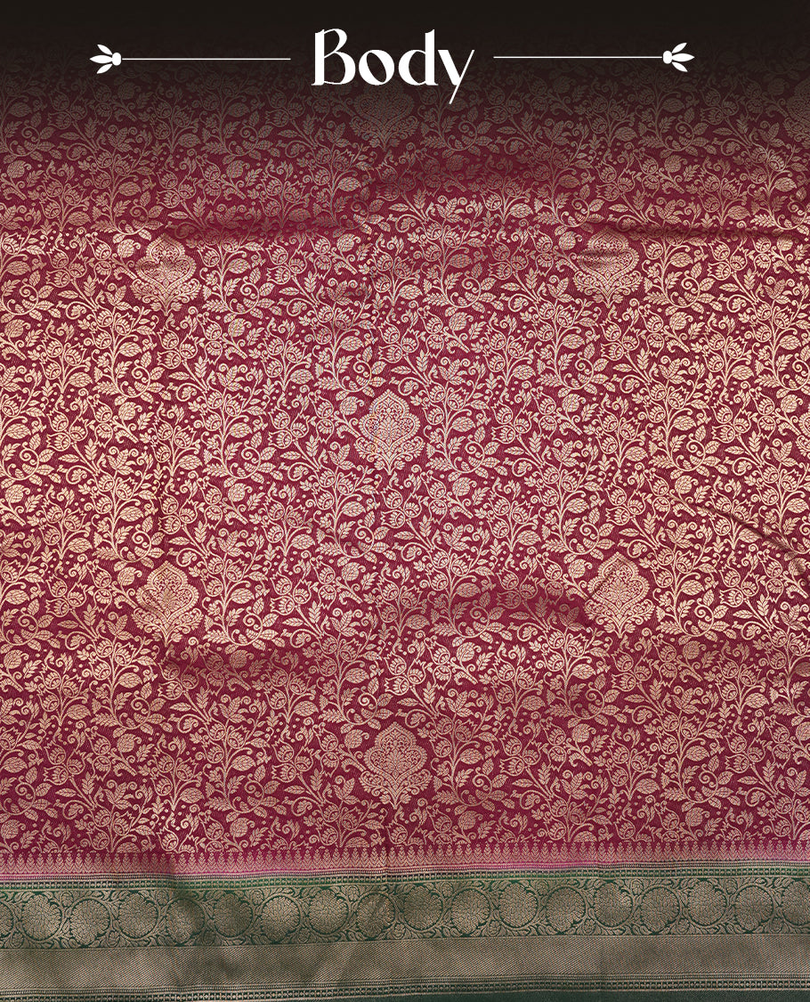 Deep Brown colour semi silk brocade saree featuring intricate Gold Floral kodi patterns across the body, complemented by a contrast rich dark green colour woven border and pallu, paired with a matching blouse.