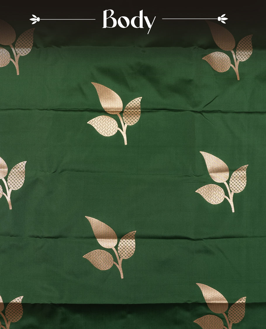 Dark green colour semi silk saree adorned with elegant floral motifs on the body, complemented by a shimmering golden zari-woven pallu and border, and paired with a matching blouse