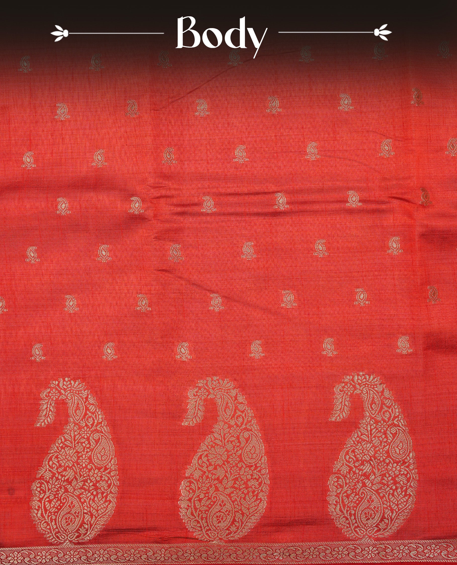 Red colour semi tussar silk saree featuring small gold zari mango motifs across the body, enhanced with a self colour border showcasing elegant gold zari mango patterns. Paired with a matching blouse piece.