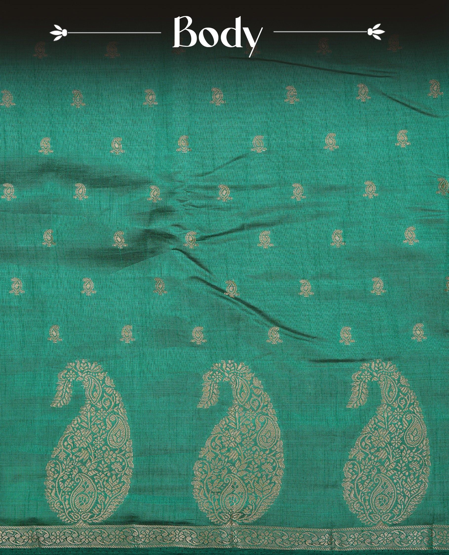 Green colour semi tussar silk saree featuring small gold zari mango motifs across the body, enhanced with a self colour border showcasing elegant gold zari mango patterns. Paired with a matching blouse piece.