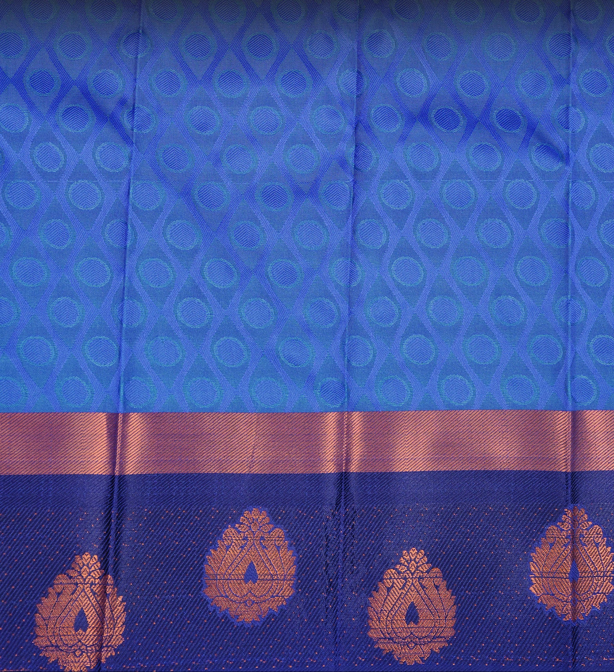 Teal green colour Semi silk saree Featuring self colour zari pattern on body, complemented by contrast Blue colour with gold zari border, paired with matching blouse piece.