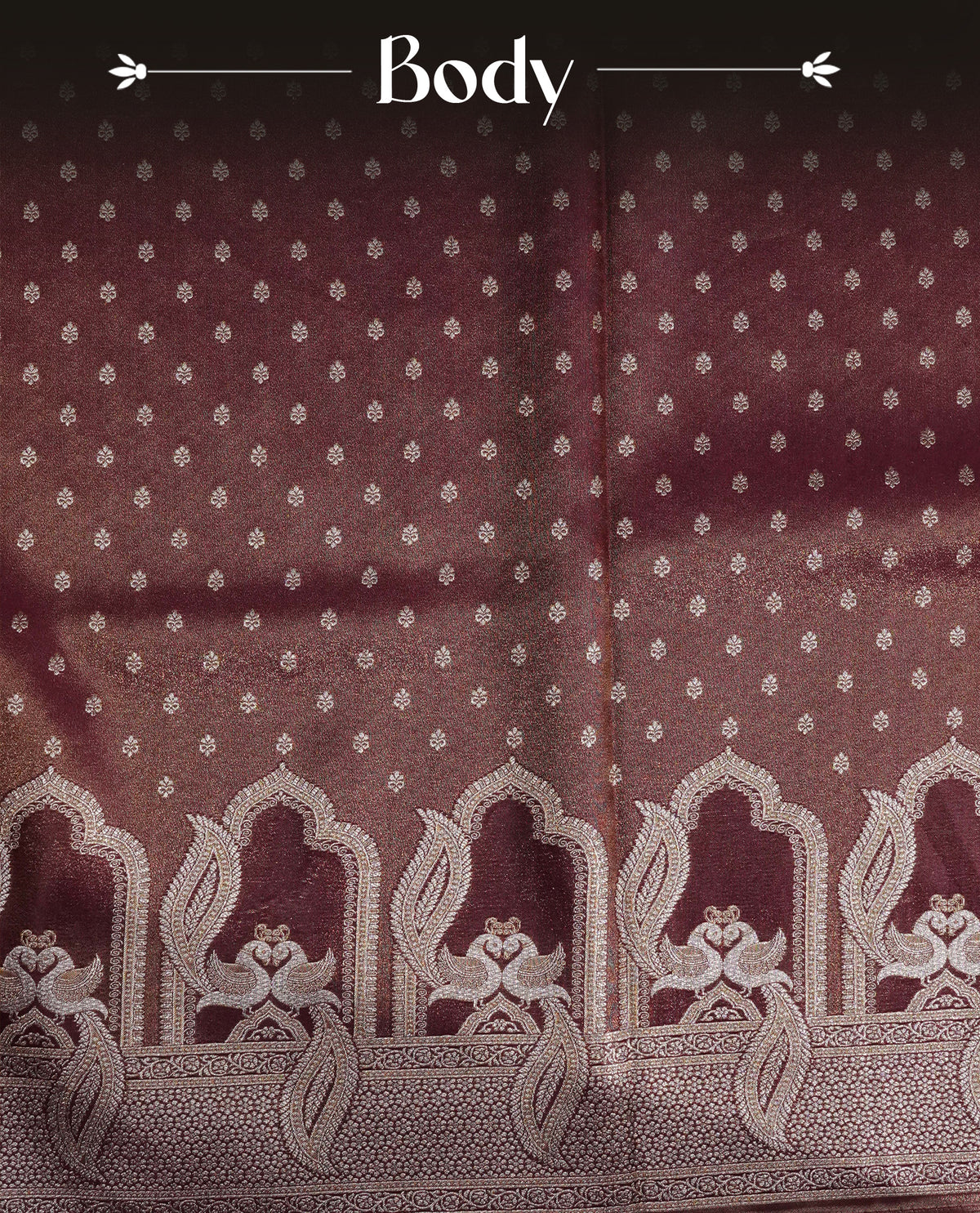 Maroon colour Mulberry silk saree featuring Gold zari buttas on body, complmented by self colour with Gold zari dual peacock in Temple design border, comes with matching blouse piece.