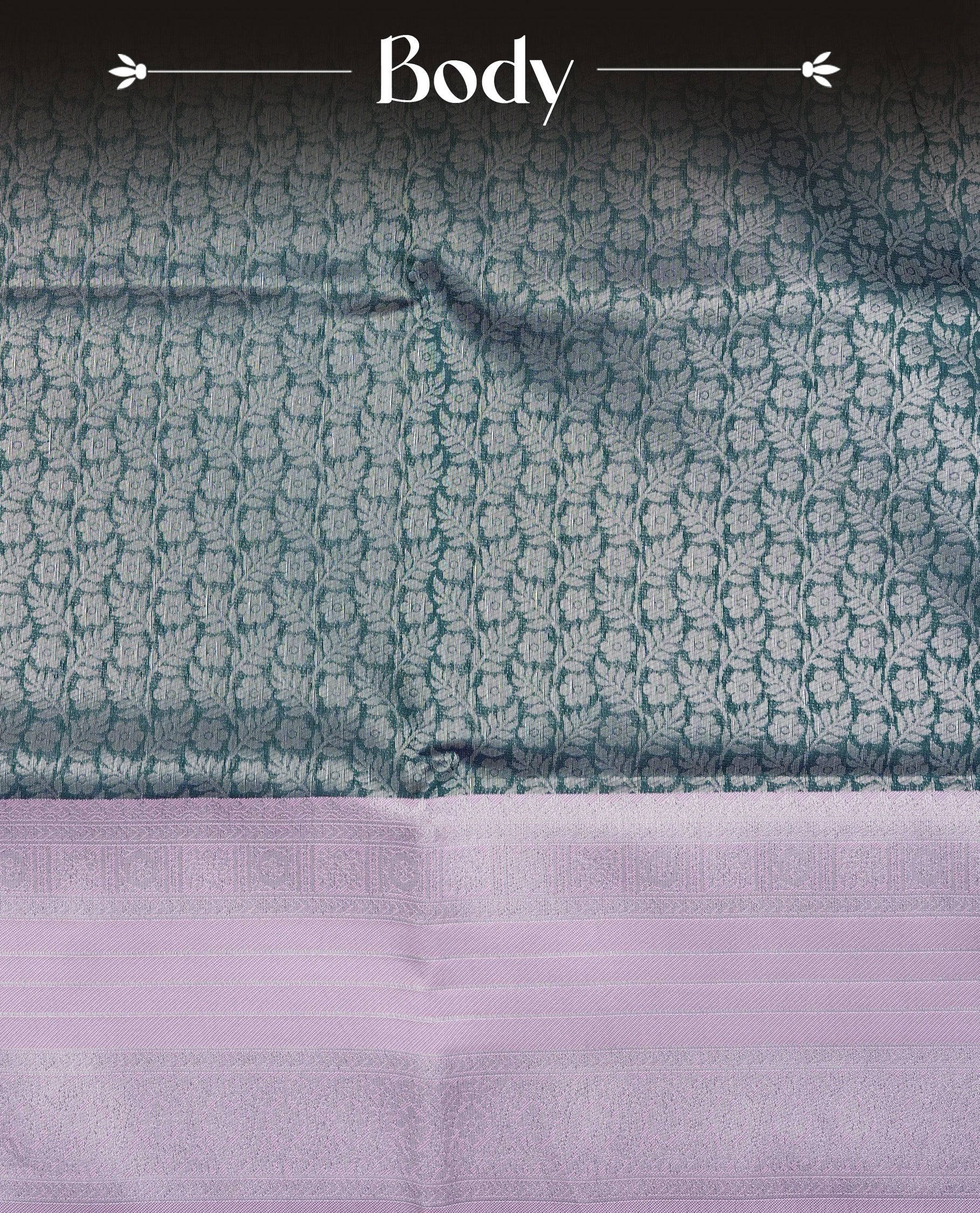 Green colour semi silk saree featuring Silver zari Floral pattern on body, complemented by contrast Purple colour with silver zari border, comes with matching blouse piece.