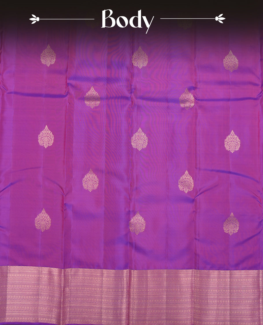 Indigo colour Vasundhara silk saree adorned with all-over gold motifs on the body, complemented by a self colour with gold tarditional border and paired with a matching blouse piece.