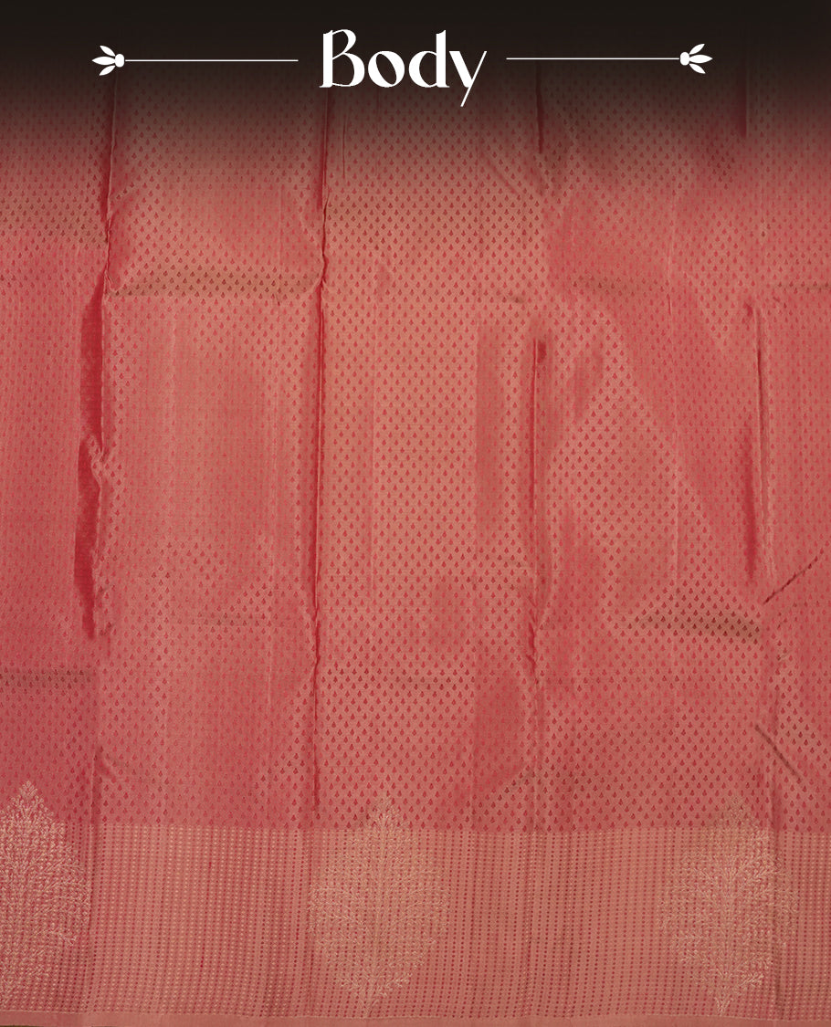 Dark mauve colour Vasundhara silk saree adorned with all-over tiny motifs on the body, complemented by a self colour with tiny diamond pattern with gold tree motifs on border and paired with a matching blouse piece.