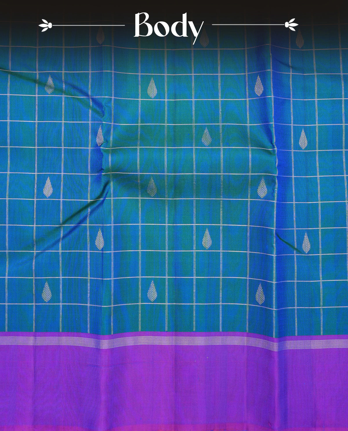 Peacock colour traditional kancheepuram silk saree featuring Silver zari Check with motifs on body, complemented by contrast purple colour with simple border, comes with matching blouse piece.