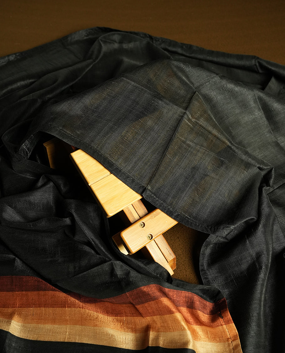 Black colour churidhar material featuring elegant horizontal stripes on the yoke and dupatta, woven in shades of Brown and Black & Paired with a matching plain bottom