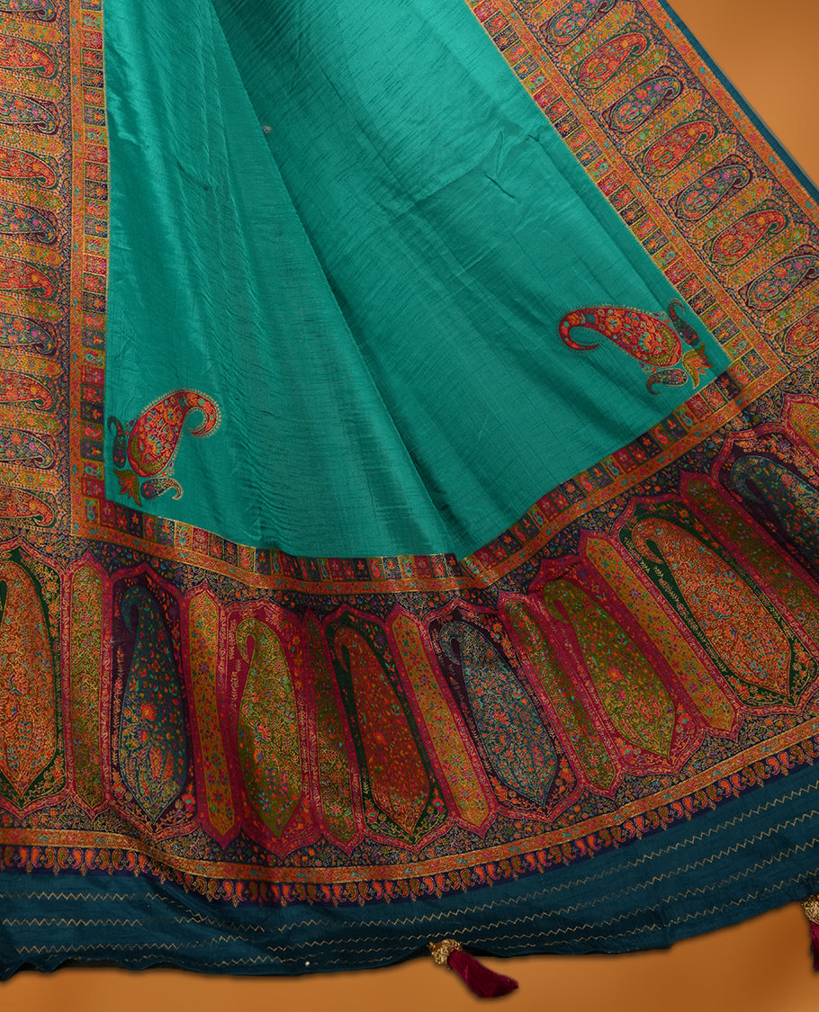 Aqua green colour Pashmina silk saree plain body, framed by an opulent arabesque border and grand storytelling pallu, paired with a matching woven border blouse piece