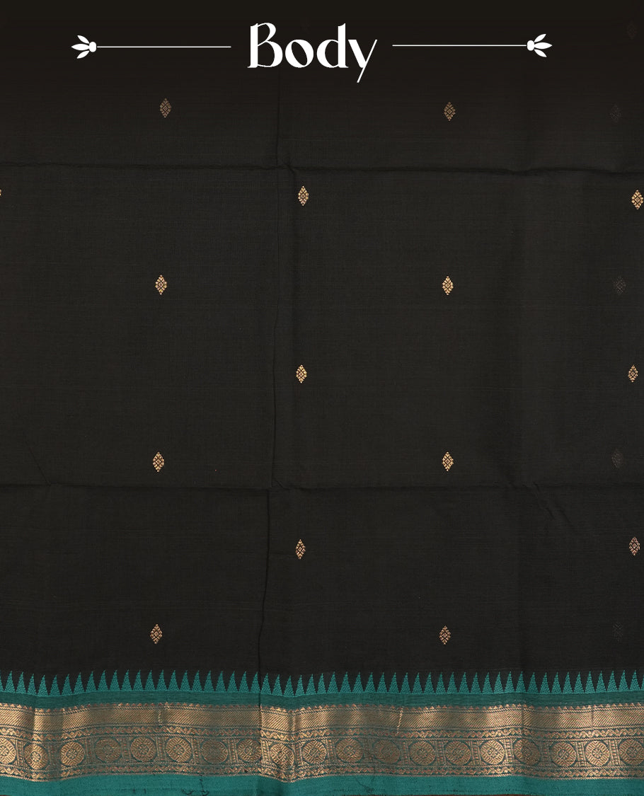 Black colour Chettinad cotton saree accentuated with a rich teal green zari border featuring intricate traditional motifs, The bold temple design enhances its ethnic charm & Comes with a matching blouse piece.