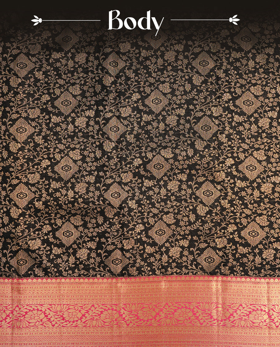 Black colour semi wedding saree featuring gold zari floral kode pattern on body, complemented by contrast magenta with traditional border, paired with matching blouse piece.
