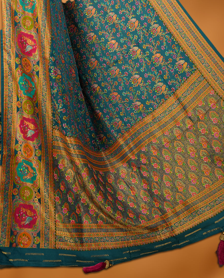 Crystal Teal blue colour Pashmina silk saree densely woven with intricate multicolour floral kodi pattern across the body, framed by an opulent arabesque border and grand storytelling pallu, paired with a matching woven border blouse piece