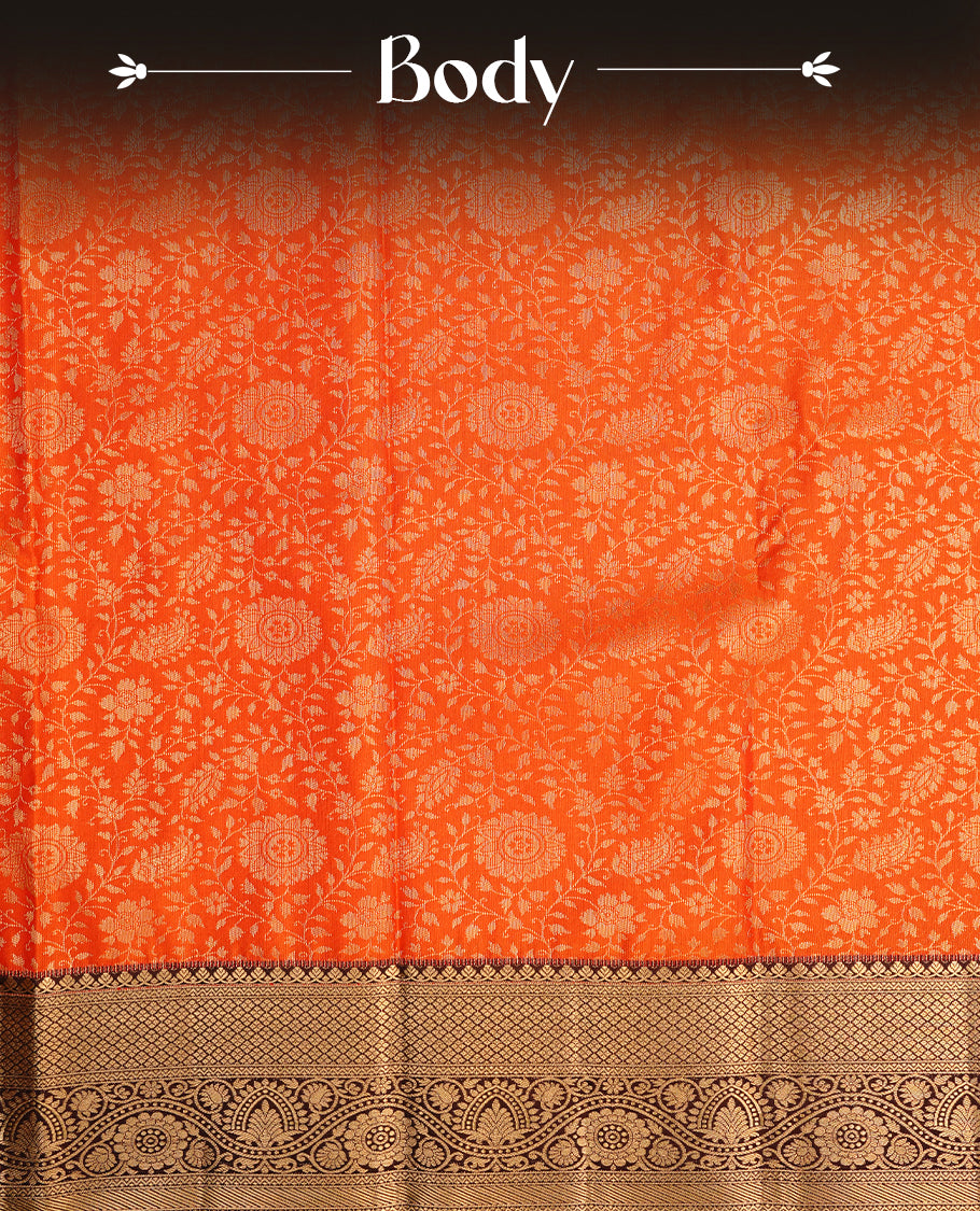 Orange colour semi wedding saree featuring gold zari floral kode pattern on body, contrast chococlate colour with traditional border, paired with matching blouse piece.