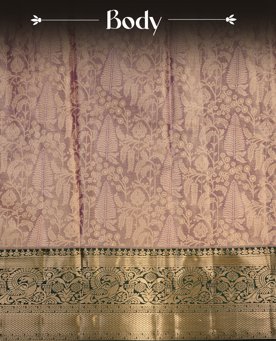 Purple & gold double shade colour semi tissue silk saree featuring gold zari floral kodi pattern on body, contrast green colour with gold zari traditional border, paired with matching blouse piece.