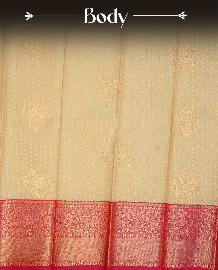 Cream coloured soft silk saree featuring gold zari dotted stripes and motifs across the body, enhanced with a contrast Magenta border and pallu, paired with a matching contrast blouse piece.