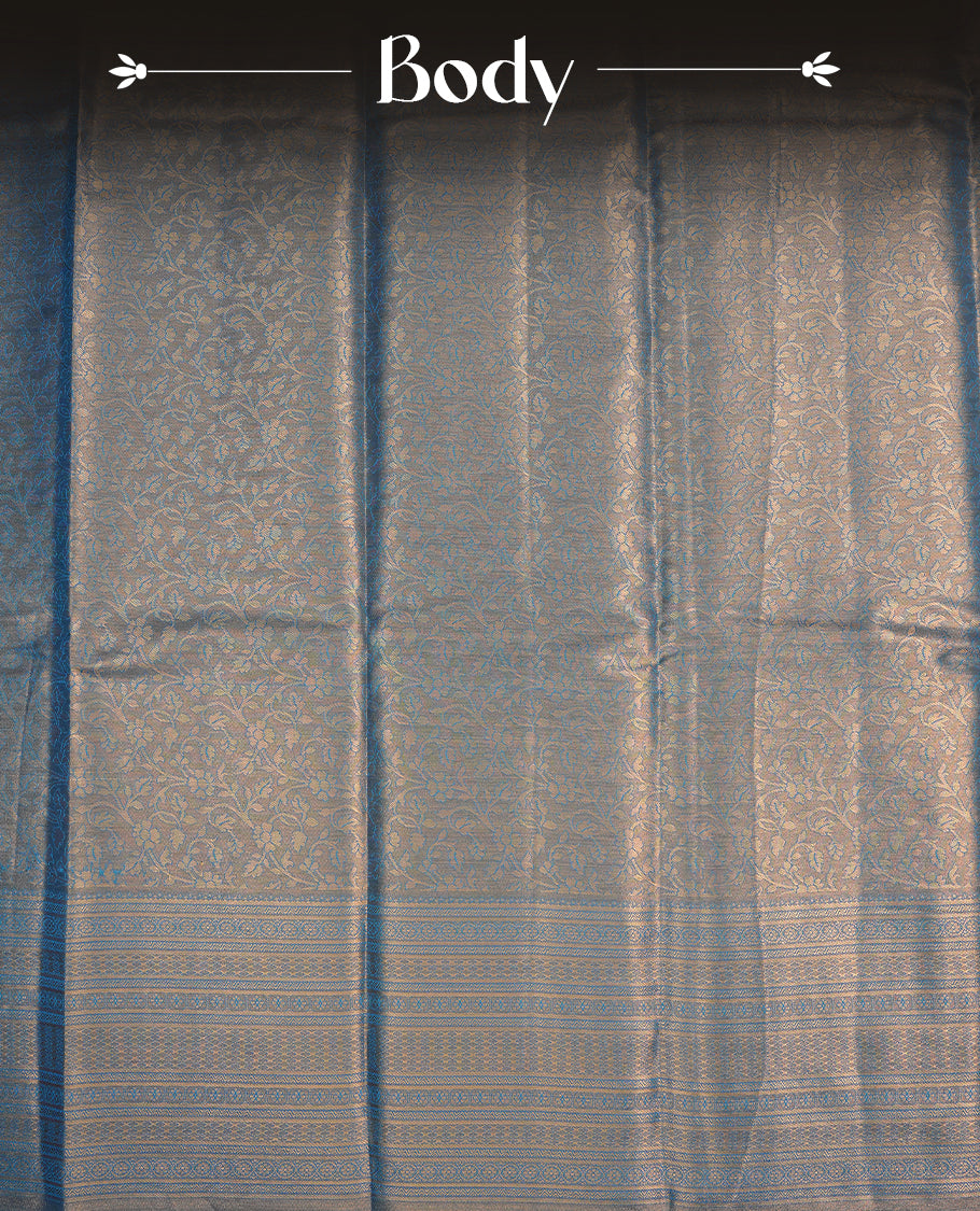 Blue & Gold colour semi tissue silk saree featuring gold zari floral kodi pattern on body, self colour with gold zari traditional border, paired with matching blouse piece.