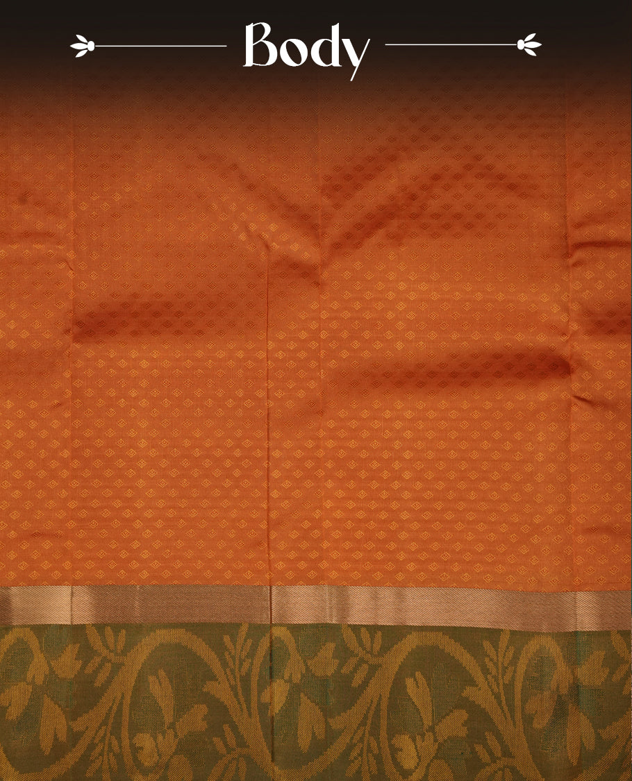 Rust orange colour soft silk saree featuring gold zari motifs on the body, complemented by a contrast Green traditional zari floral kodi border and pallu, paired with a matching blouse piece.