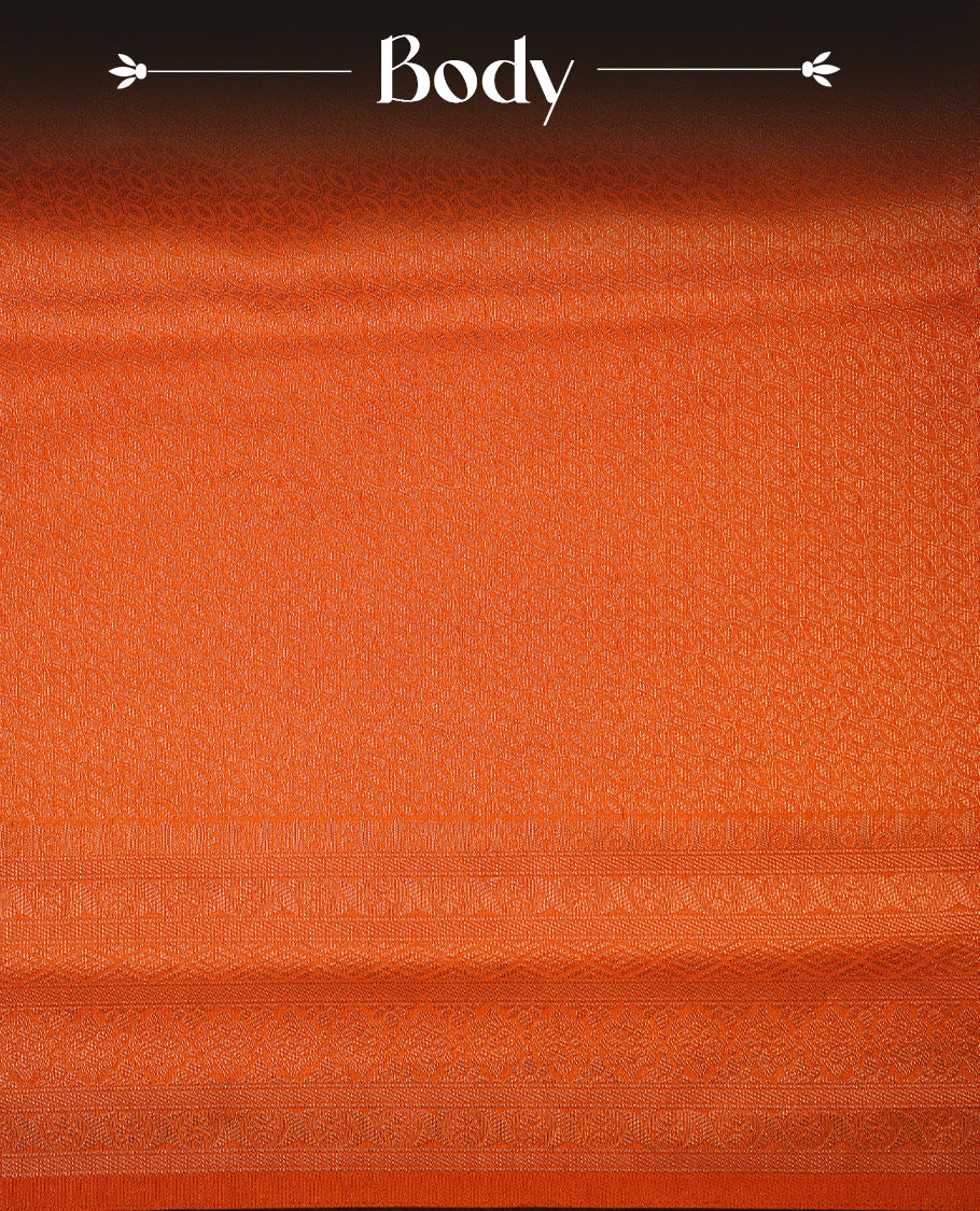 Orange colour softie silk saree featuring ovel shape stripes across body, complemented by self colour with traditional border, paired with matching blouse piece.