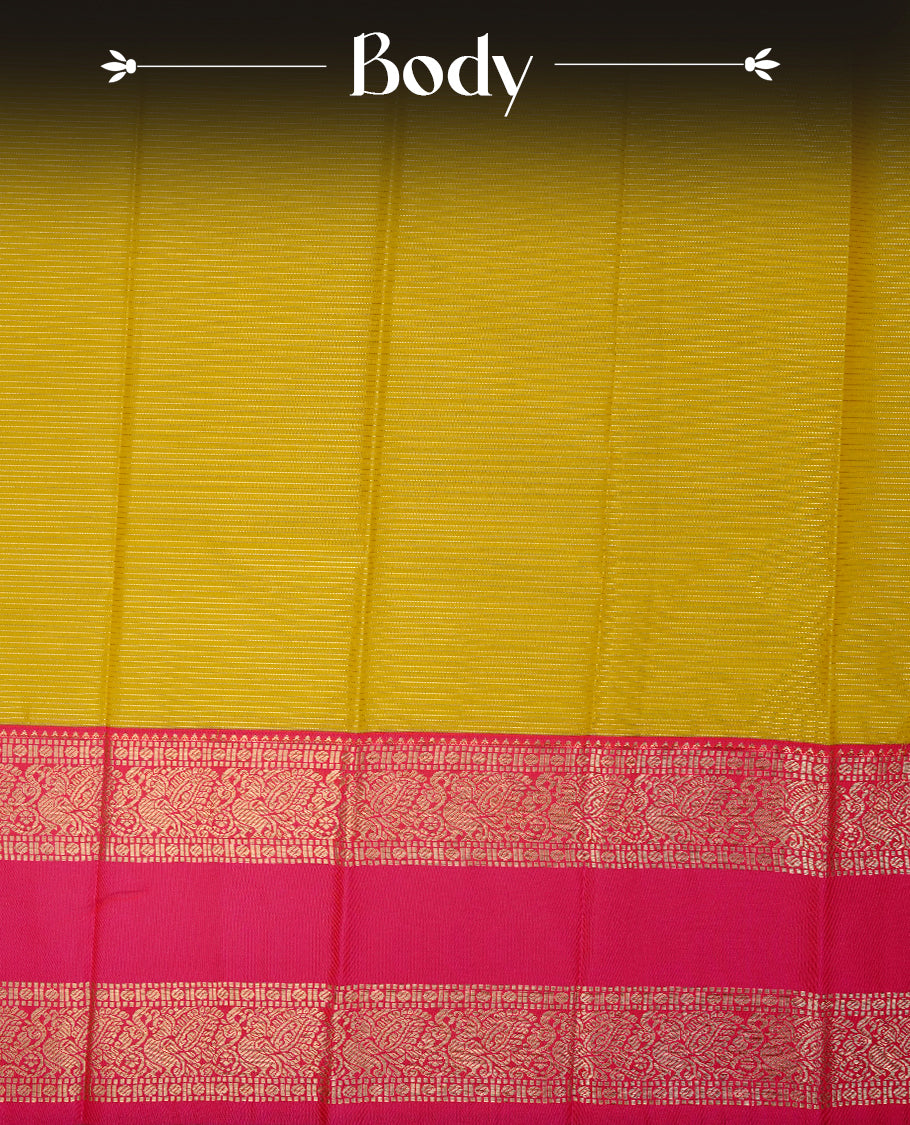 Old gold coloured soft silk saree featuring gold zari stripes and motifs across the body, enhanced with a contrast Magenta border and pallu, paired with a matching contrast blouse piece.